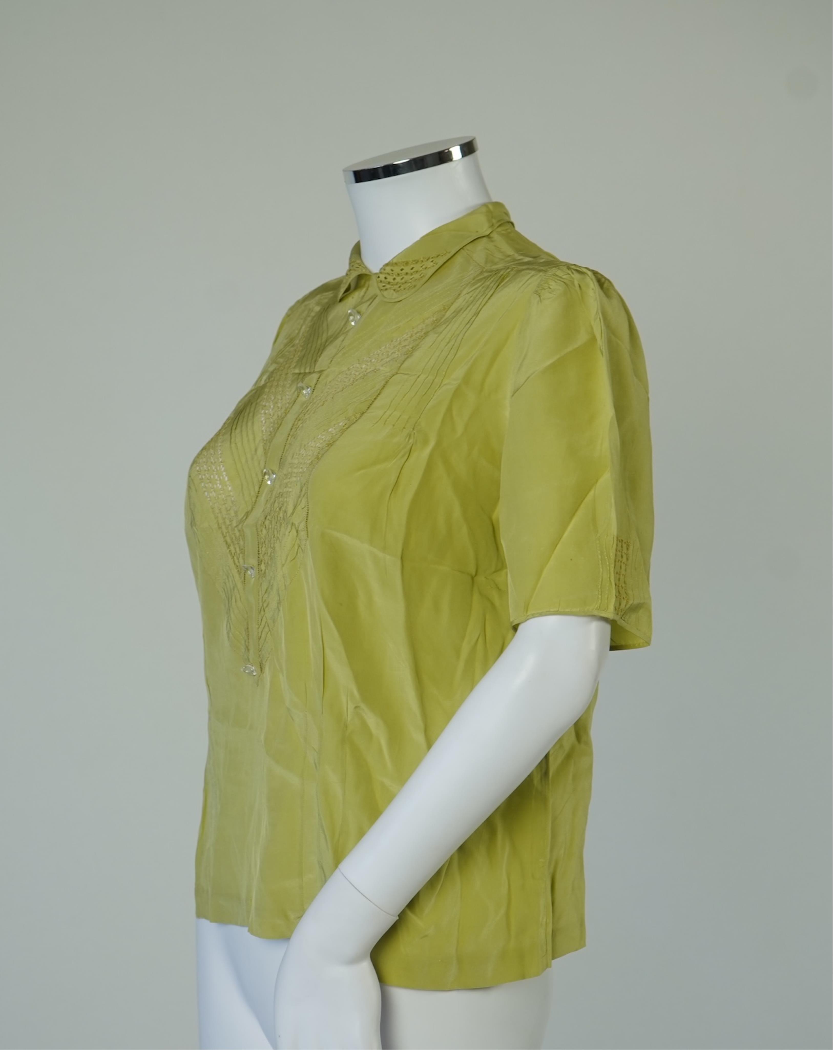 A 1940’s-50’s short sleeve lime green silk embroidered blouse, a pale pink silk crepe long sleeved blouse with white lace and a late 19th century navy silk chiffon blouse. Condition - the navy blouse is fragile but may b